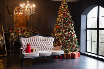 Interior of luxury dark living room with fireplace, comfortable sofa and chandelier decorated with...