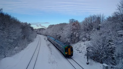 Fotobehang Green Train in snow with Tyseley Incinerator © Helen
