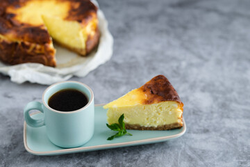 Slice of cheesecake with a cup of coffee. Copy space.