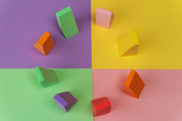 Fototapeta na wymiar Top view of multi-colored sponges on different pastel-colored backgrounds. Abstract image