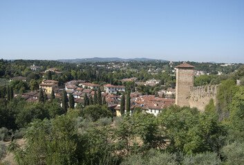 
view of the Tuscan hills with tower and fortification wall