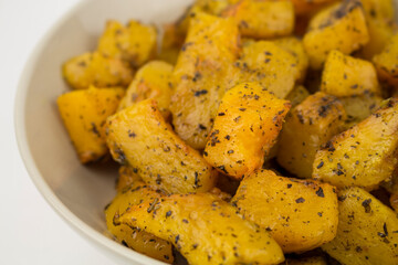 Baked slices of ripe orange pumpkin in a bowl