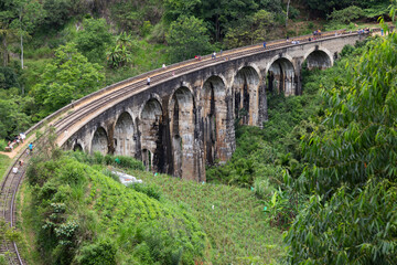 Fototapeta na wymiar Ella Sri Lanka 4.15.2018 the 9 arch Demodara Railway Bridge spanning gorge