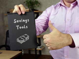 Business concept about Savings Tools W with inscription on the piece of paper.
