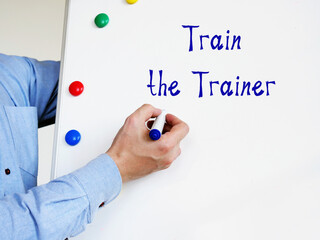 Financial concept meaning Train the Trainer with inscription on the sheet.