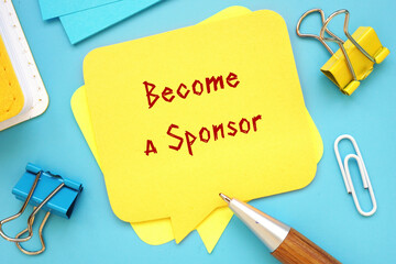 Business concept meaning Become a Sponsor with phrase on the piece of paper.