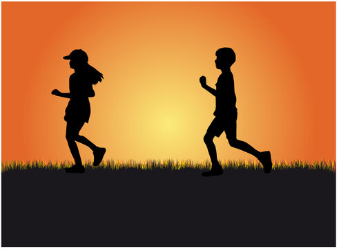 Children silhouettes in nature.  Running in sunset.