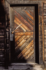 old decayed brown wooden door