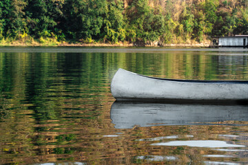 Srinakarin Dam in Kanchanaburi landmark for peace placid adventure travel holiday vacation panorama landscape view floating house sunset lake river boat canoe kayak water reflection sky forest trees