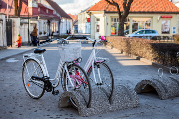 Bicycle parking station with bikes is in the Kuressaare town at winter season, Estonia
