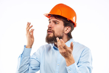 Emotional man gesturing with his hands construction industry orange hard hat work