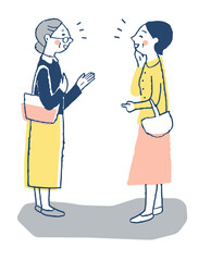 笑顔で立ち話をする女性2人