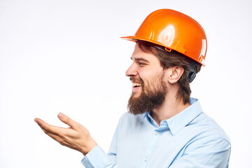 Man in orange helmet shirt construction engineer industry work