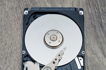 Disassembled hard drive from the computer, hdd with mirror effect. Part of computer pc, laptop