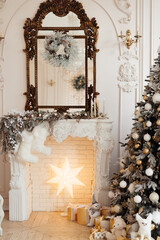 Christmas tree by the fireplace. home decoration for Christmas and new year. High quality photo