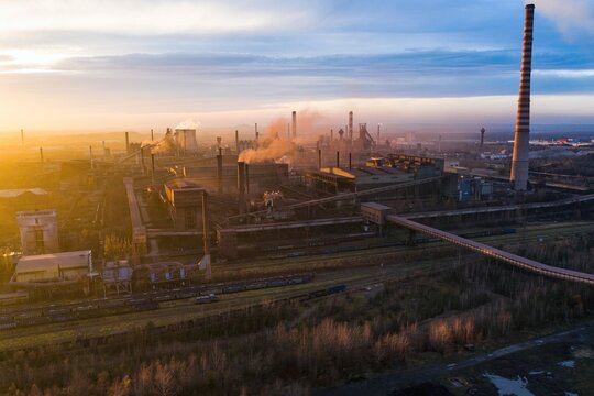 Industrial steel factory, iron works. Metallurgical plant. steelworks. Heavy industry in Europe, Poland, Dabrowa Gornicza. Air pollution from chimneys. Ecology and environmental. Aerial drone view