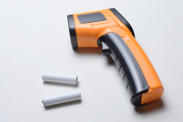 non-contact handheld pyrometer thermometer, yellow. and batteries for it.