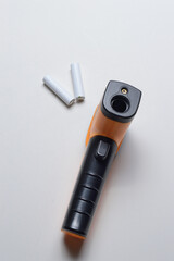 non-contact handheld pyrometer thermometer, yellow. and batteries for it.
