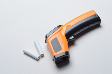 non-contact handheld pyrometer thermometer, yellow. and batteries for it.