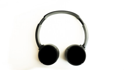 Black wireless headphones on a white background.