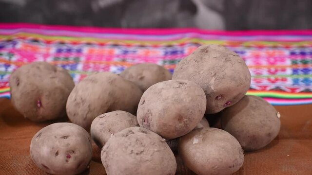 potato falling in slow motion with colored blanket