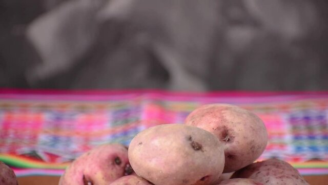 potato falling in slow motion with colored blanket