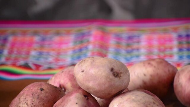 potato falling in slow motion with colored blanket