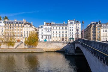 Fototapeta premium Paris, the Tournelle bridge, beautiful facades quai d’Orleans on the ile Saint-Louis 