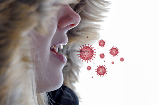 Seitenansicht des Gesichts einer jungen Frau, die Viren ausatmet - Konzept für die Infektion via Aerosole