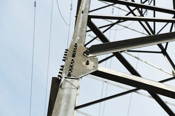 Directly Below Of Electricity Pylon Against Sky 