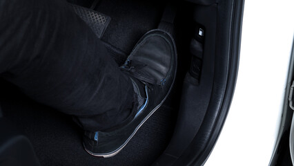 Close up images of man driving car by pushing accelerator and brake pedal with right foot black...