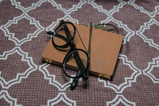 old glasses and book