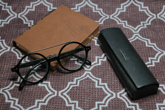 old glasses and book