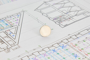 architectural plan of the house on the sheet are the keys and credit card, the concept of buying a mortgage under construction