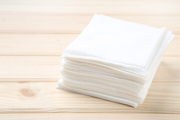Paper napkins on brown wooden table
