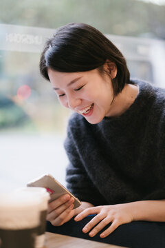 Young Woman sittinge In The Cafeteria
