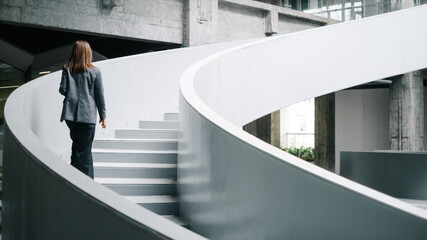Businesswoman On Office Staircase