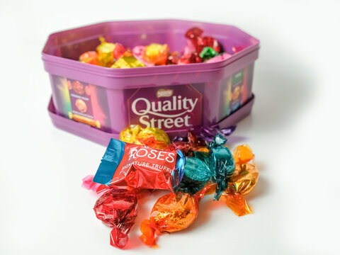 Norwich, Norfolk, UK – November 08 2020. Illustrative editorial photo of a plastic box full of Quality Street chocolates 