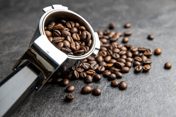Roasted coffee beans in coffee filter holder