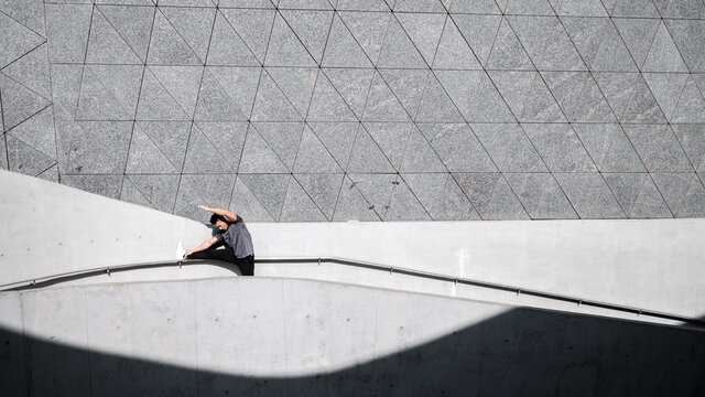 A Chinese man is exercising in the city