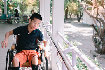 Disabled child on wheelchair is smiling,playing,learning in the outdoor park activity like other people,Lifestyle of special kid, Life in the education age of children, Happy disability kids concept.