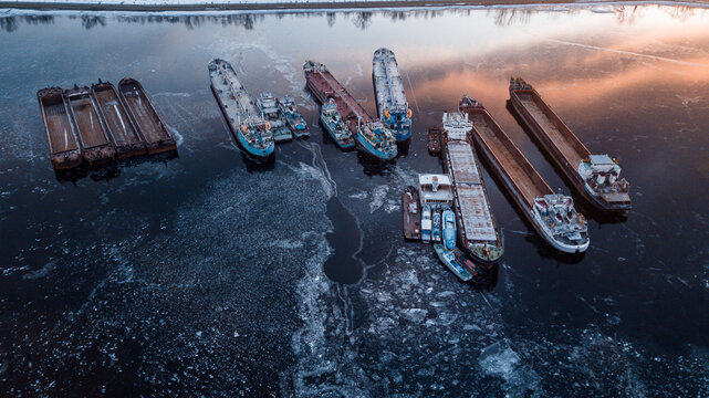 Frozen ships in the middle of an icy river