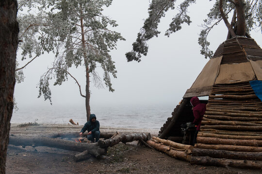 stay in a forest cabin on a winter day