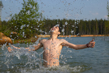 Fototapeta na wymiar cute boy happily bathes in the water