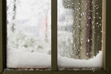 Snow piled on a window ledge