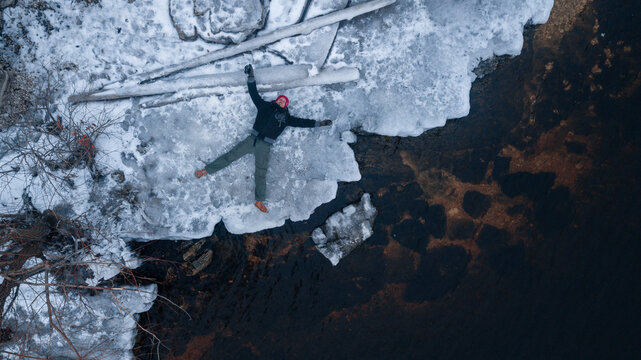 Young man on a melting ice floe