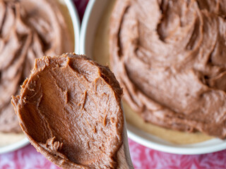 wooden spoon and chocolate cake batter 