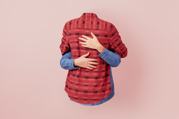 Two shirts hug each other.