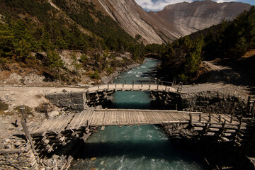 Himalayan landscape - old wooden bridge in the mountains