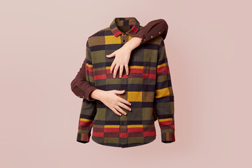 Caucasian hands hug a shirt